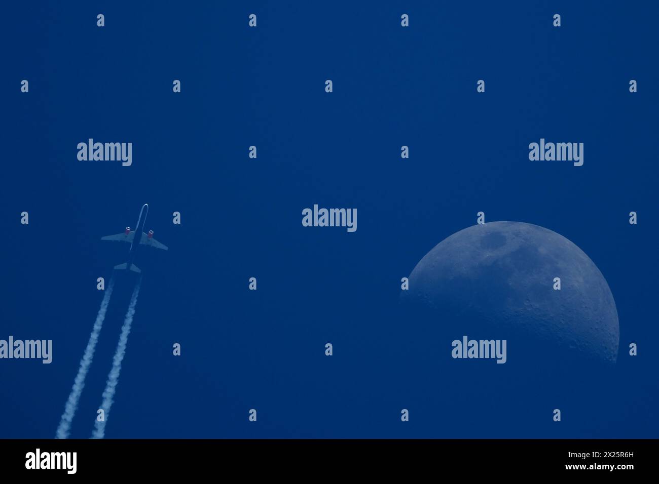 Moon aircraft contrails contrails hi-res stock photography and images ...
