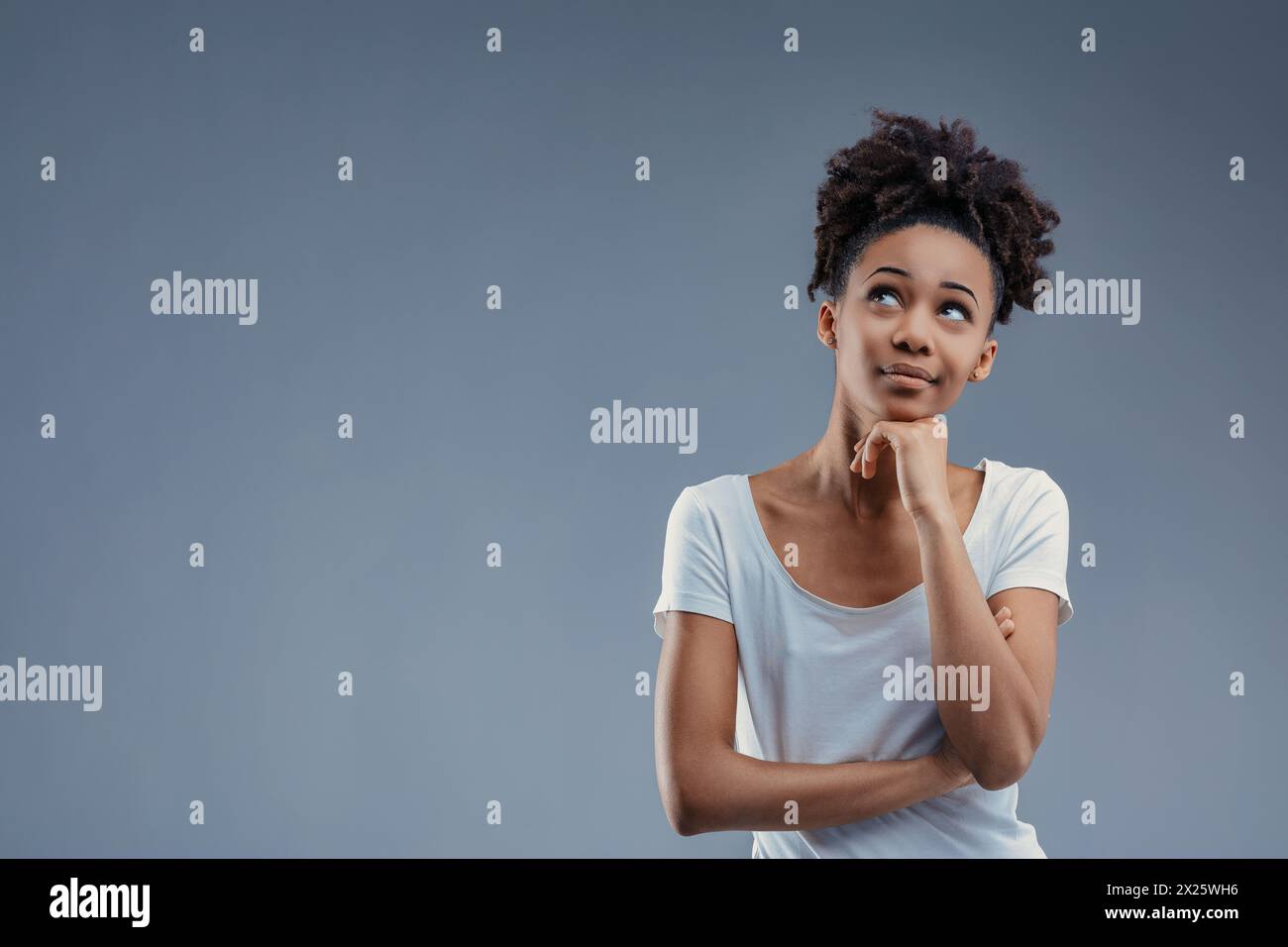 Idea in motion, a confident Black woman gestures upward with purpose Stock Photo