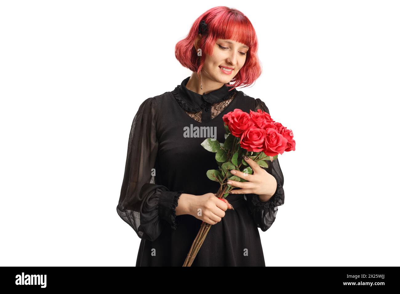 Woman in a black dress holding a bunch of red roses isolated on white ...