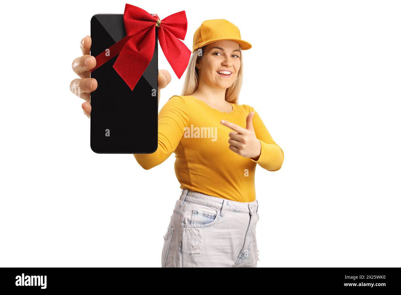 Young female holding a new smartphone with a red bow isolated on white background Stock Photo