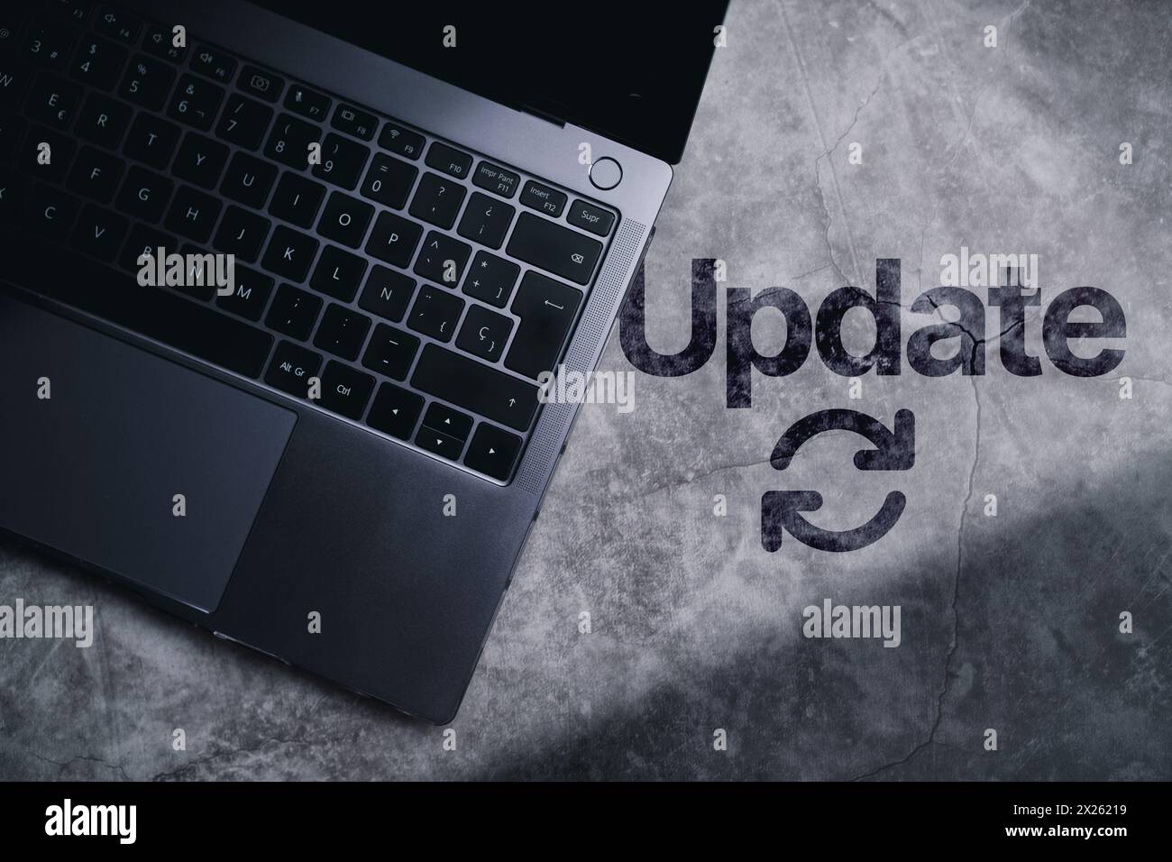 Desktop top view with laptop and the word update written on surface. Software upgrade concept with empty space for use. Stock Photo