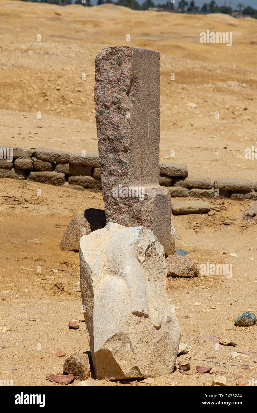 Egypt, Fayum, Hawara, small open air museum near the pyramid of Amenemhat III : Maybe a Hathor statue, and a piece of granit. Stock Photo