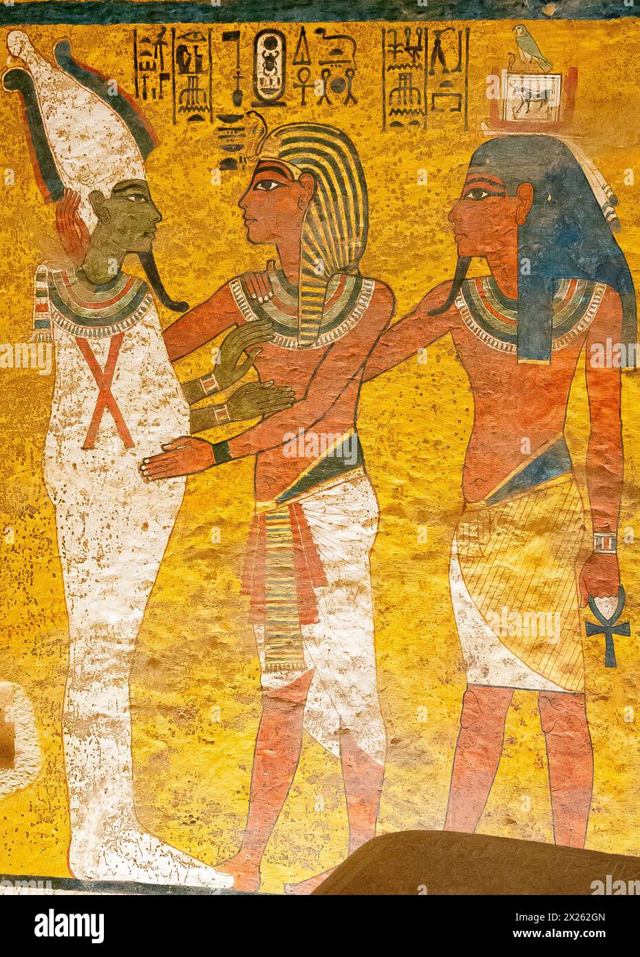 Egypt, Luxor, tomb of Tutankhamun, North wall of the funeral room : Tutankhamun, followed by his Ka, embraces Osiris. Stock Photo