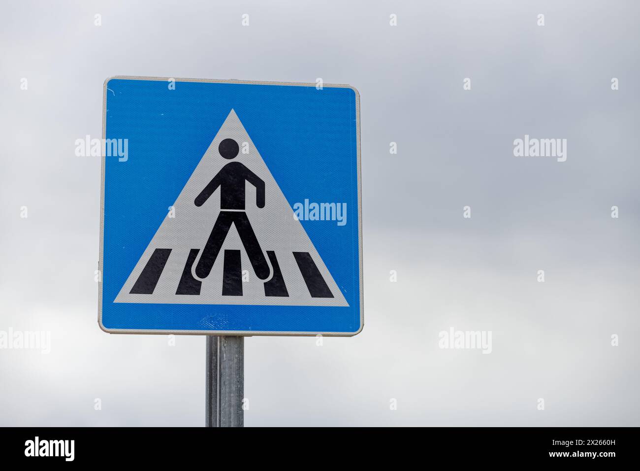 a traffic sign indicating crossing the road Stock Photo