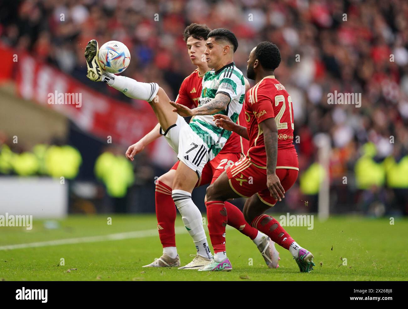 Celtic's Luis Palma (centre) battles with Aberdeen's Jack Milne (left