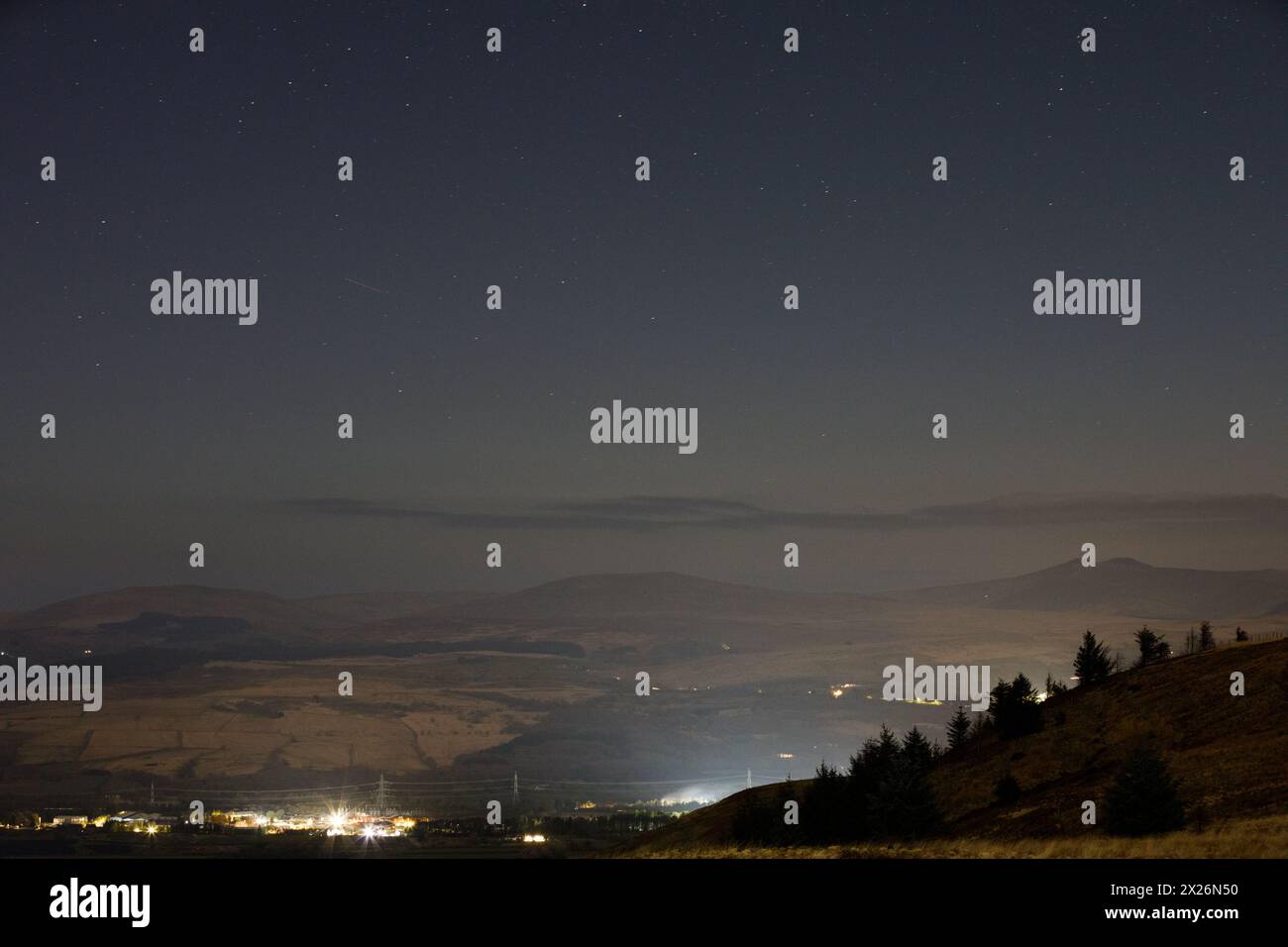 Rhigos Viewpoint, South Wales, UK.  20 April 2024.  A faint glow of the Northern Lights were visible tonight, looking towards the Brecon Beacons.  Credit: Andrew Bartlett/Alamy Live News Stock Photo