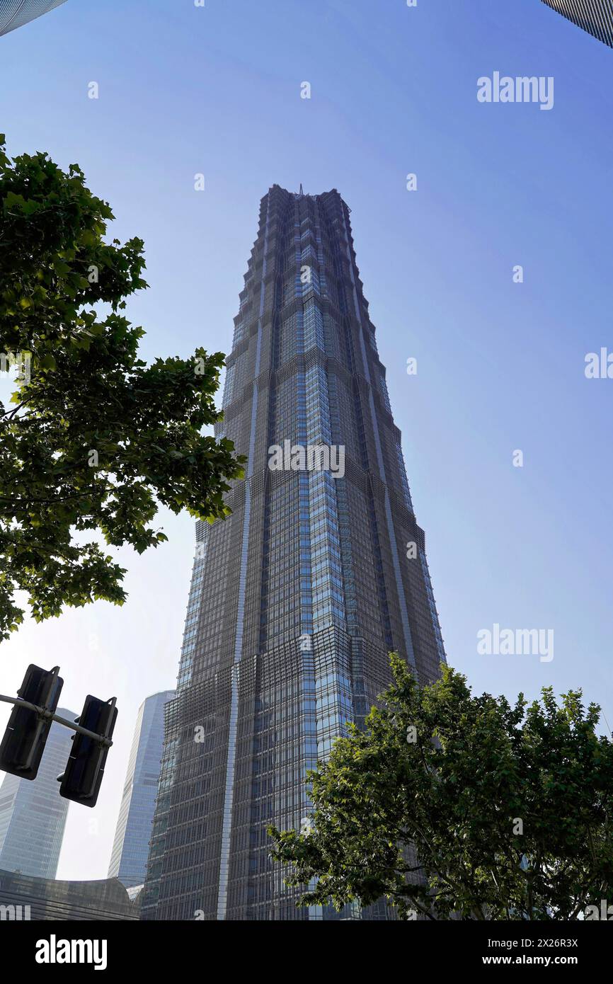 Jin Mao Tower, nicknamed The Syringe at 420 metres, futuristic skyscraper with pronounced geometric shapes under a blue sky, Shanghai, China Stock Photo