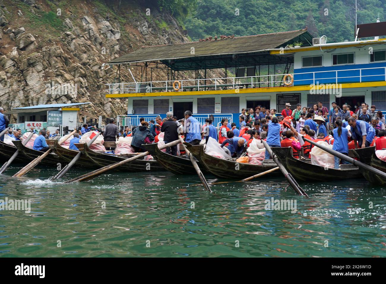 Passengers boarding boats at a pier for a tour on the river, Yichang ...
