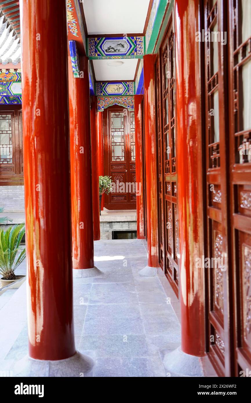 Chongqing, Chongqing Province, China, Asia, corridor between red columns of traditional Chinese architecture Stock Photo