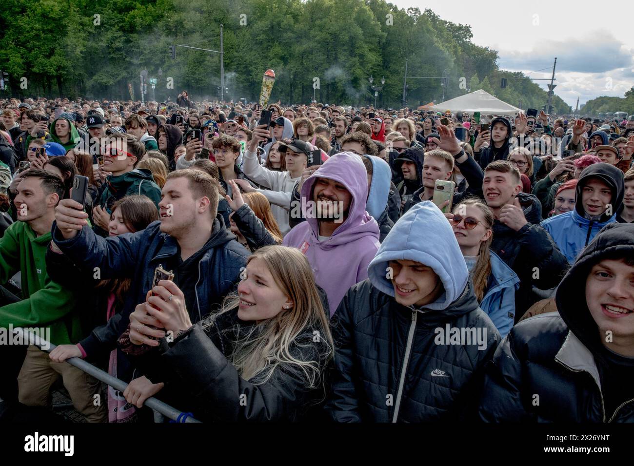 People gathered at the Brandenburg Gate in Berlin on Saturday, April 20, 2024, to celebrate the first legal 'Smoke-In' event, marking 420 Day, a date internationally recognized as a celebration of cannabis culture. Performances by notable acts such as Marsimoto, Green, Marvin Game, Ganjaman, and parts of Culcha Candela entertained the crowd, including prominent figures like Judge Andreas Müller of Bernau District Court. Müller, a well-known advocate for cannabis legalization, has been a visible proponent in the push for reform. Event organizers emphasized its significance as a demonstration of Stock Photo
