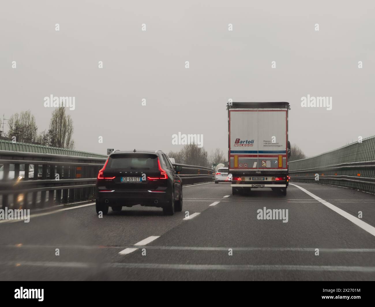 Milan, Italy - April 26th 2023 on the road on a highway under cloudy conditions, A1 A8 highway near Milan, Italy Stock Photo