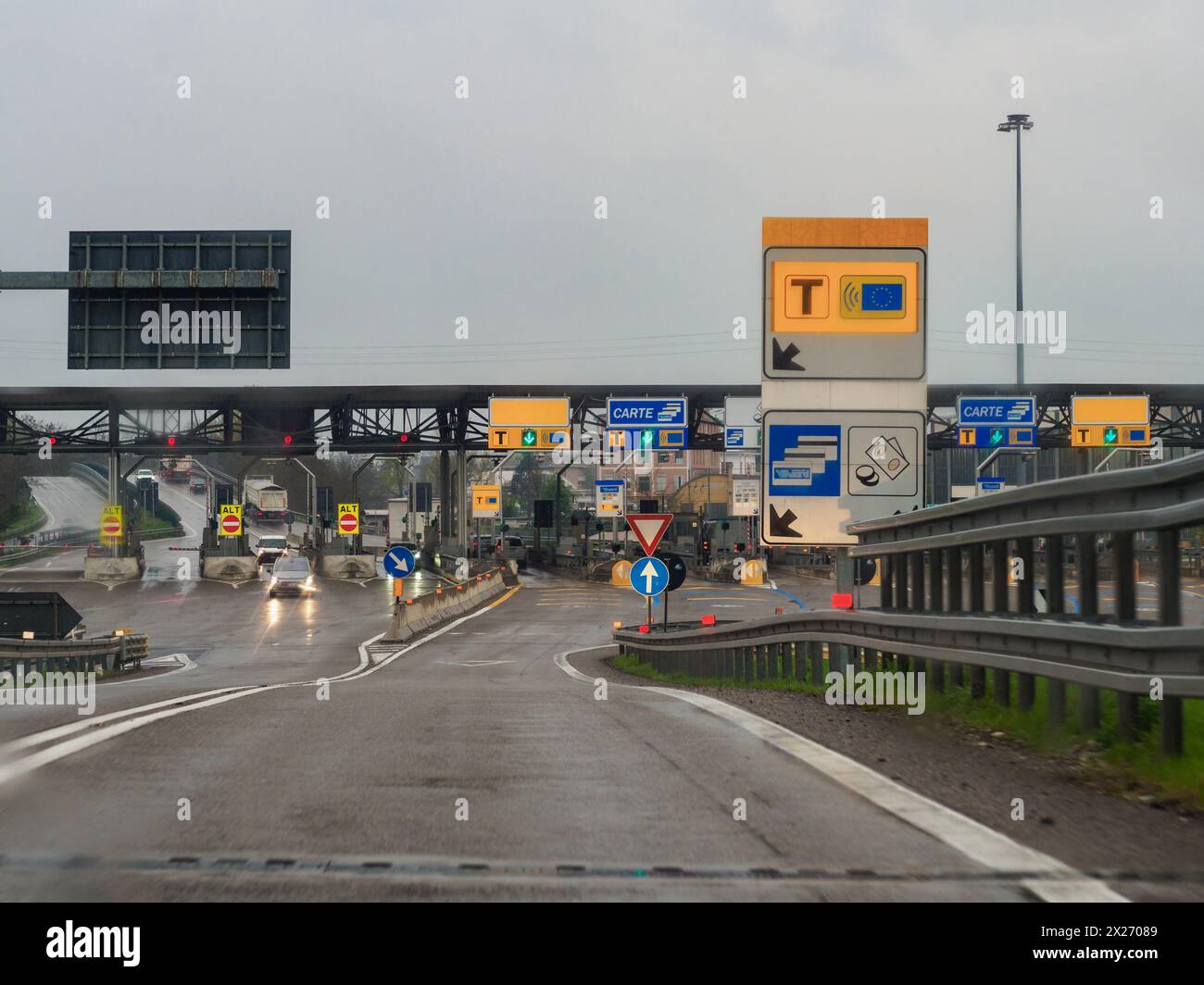 Milan, Italy - April 26th 2023 Approaching a toll booth with a navigation device in the foreground, A1 highway Stock Photo
