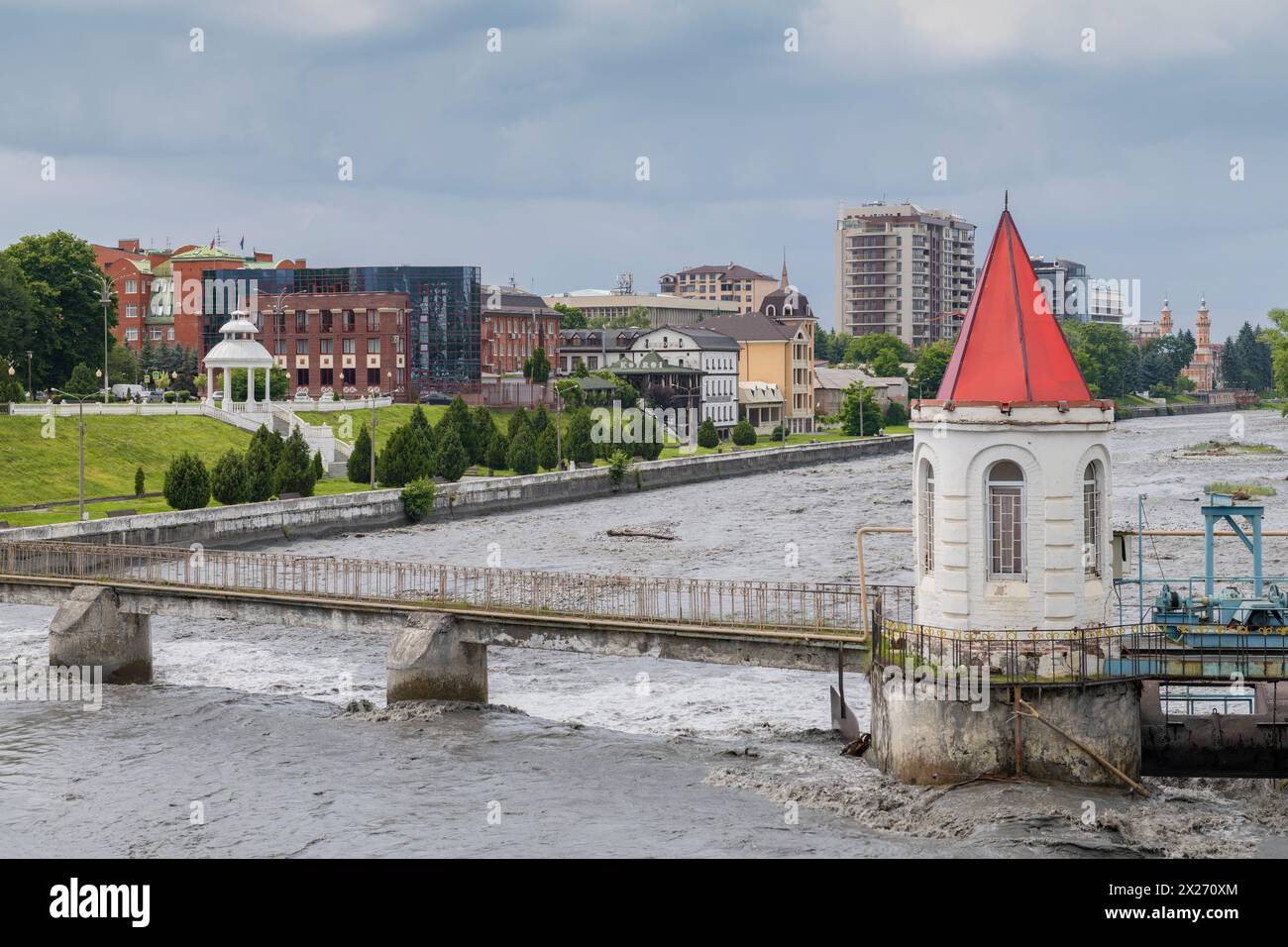 VLADIKAVKAZ, RUSSIA - JUNE 13, 2023: Bridge over the dam on the Terek river on a cloudy June day Stock Photo