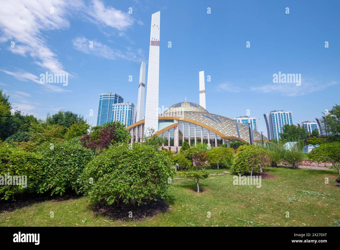 ARGUN, RUSSIA - JUNE 14, 2023: “Mother’s Heart” mosque (mosque named after Aimani Kadyrova) in a summer landscape on a sunny day Stock Photo