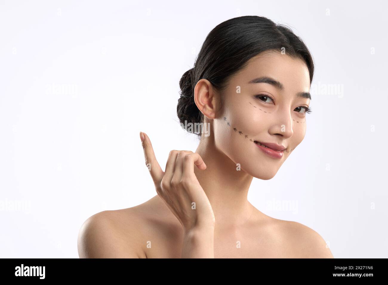 Young women undergoing facial contouring and cosmetic surgery Stock Photo