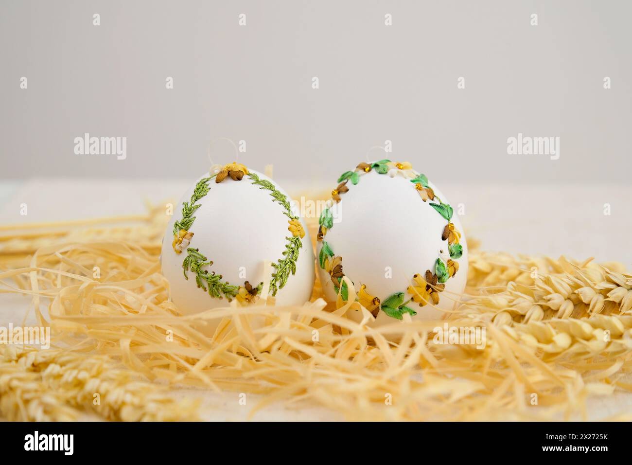 Colourful Easter eggs with different patterns aligned on background Stock Photo