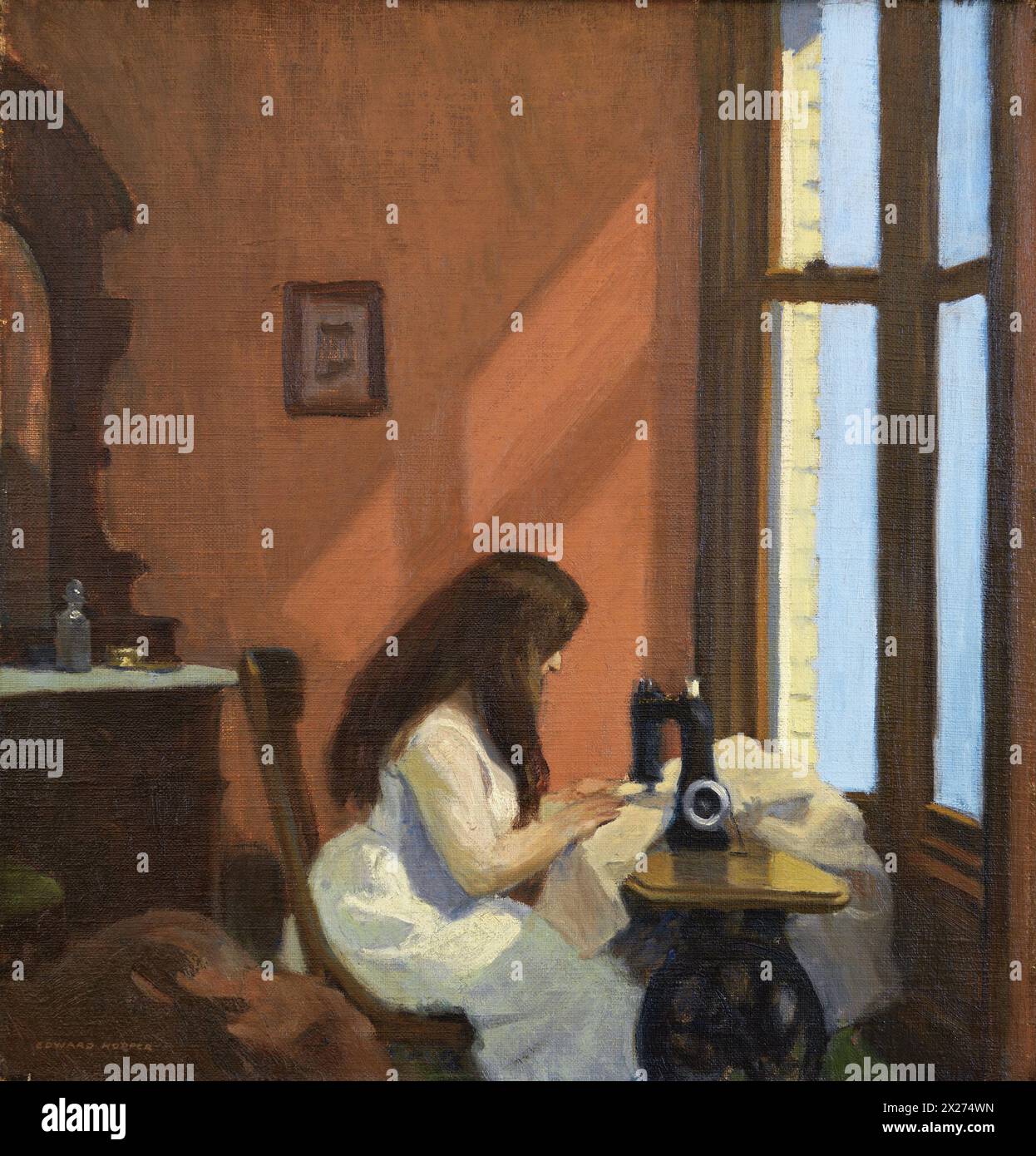 Girl at Sewing Machine is an oil-on-canvas painting by Edward Hopper, executed in 1921, now in the Thyssen-Bornemisza Museum in Madrid, Spain. Stock Photo