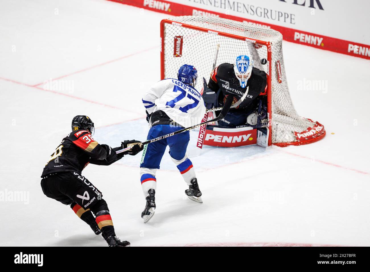 Augsburg, Germany. 20th Apr, 2024. Ice hockey: International match, Germany - Slovakia in the Curt-Frenzel-Stadium. Martin Fasko-Rudas of Slovakia (M) scores to make it 4:5. Goalkeeper Florian Bugl of Germany (r) is unable to keep the puck out. Fabio Wagner of Germany defends on the left. Credit: Matthias Balk/dpa/Alamy Live News Stock Photo