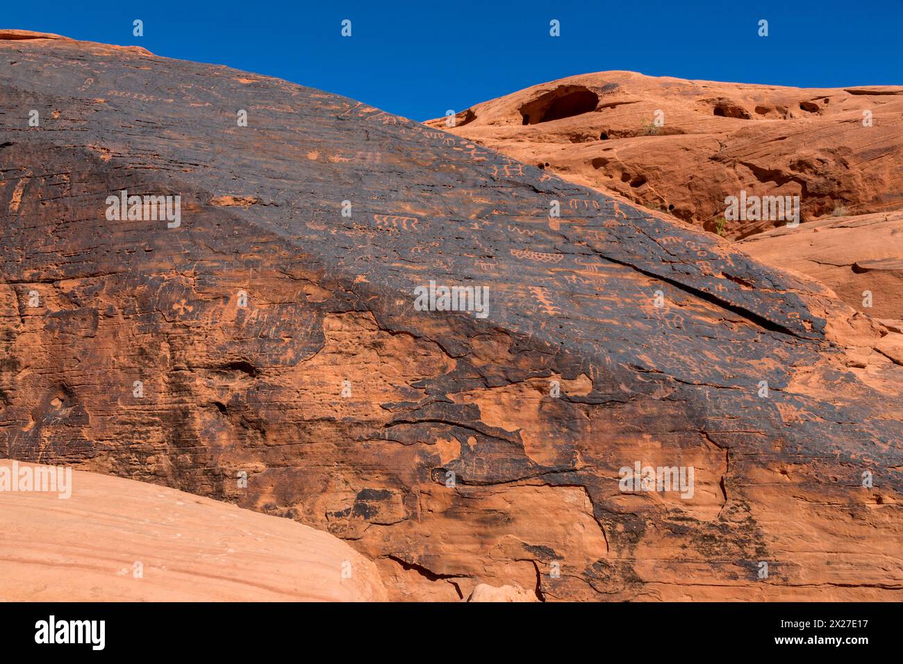 Valley of Fire, Nevada.  Indian Petroglyphs on Desert Varnish, Mouse's Tank Trail. Stock Photo