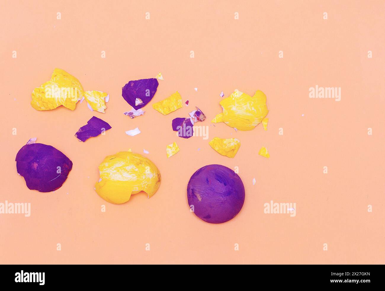 Multi-colored eggshell from Easter eggs on a pink background. Happy easter concept Stock Photo