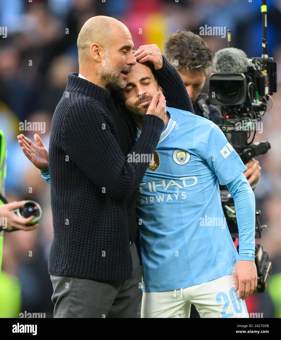 London, UK. 20th Apr, 2024 - Manchester City v Chelsea - FA Cup Semi-Final - Wembley.                                                                                      Pep Guardiola celebrates with goalscorer and match-winner Bernardo Silva at the final whistle.                                                                  Picture Credit: Mark Pain / Alamy Live News Stock Photo