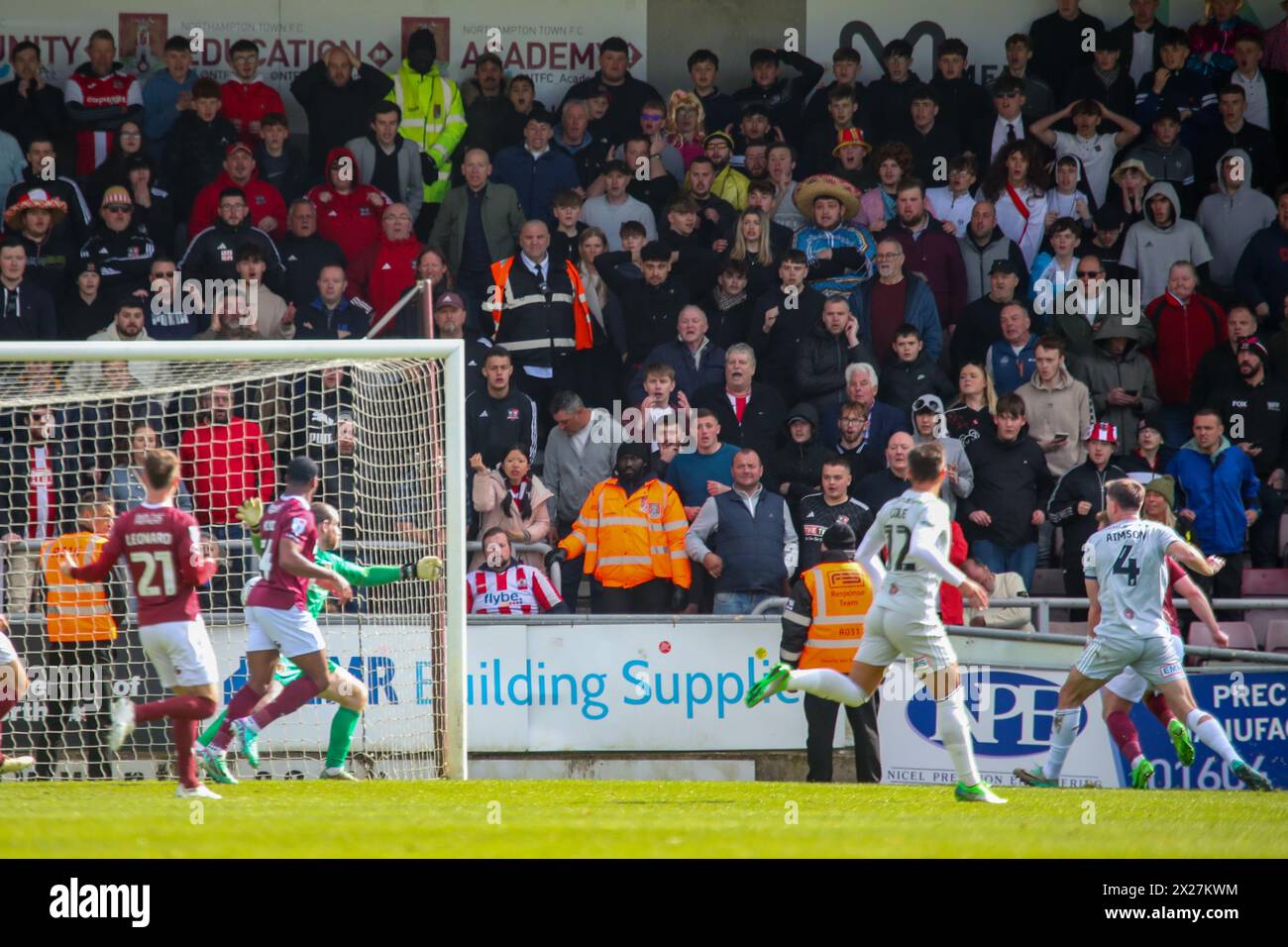 Northampton 20 April 2022:Exeter City's Will Aimson fires past Northampton Town goal keeper Lee Burge to score Exeter second and match winning goal in the EFL Division 1 Northampton Town v Exeter City Credit: Clive Stapleton/Alamy Live News Stock Photo