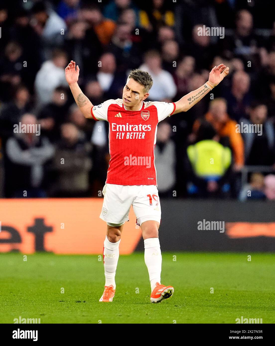 Arsenal's Leandro Trossard celebrates scoring their side's first goal of the game during the Premier League match at Molineux Stadium, Wolverhampton. Picture date: Saturday April 20, 2024. Stock Photo