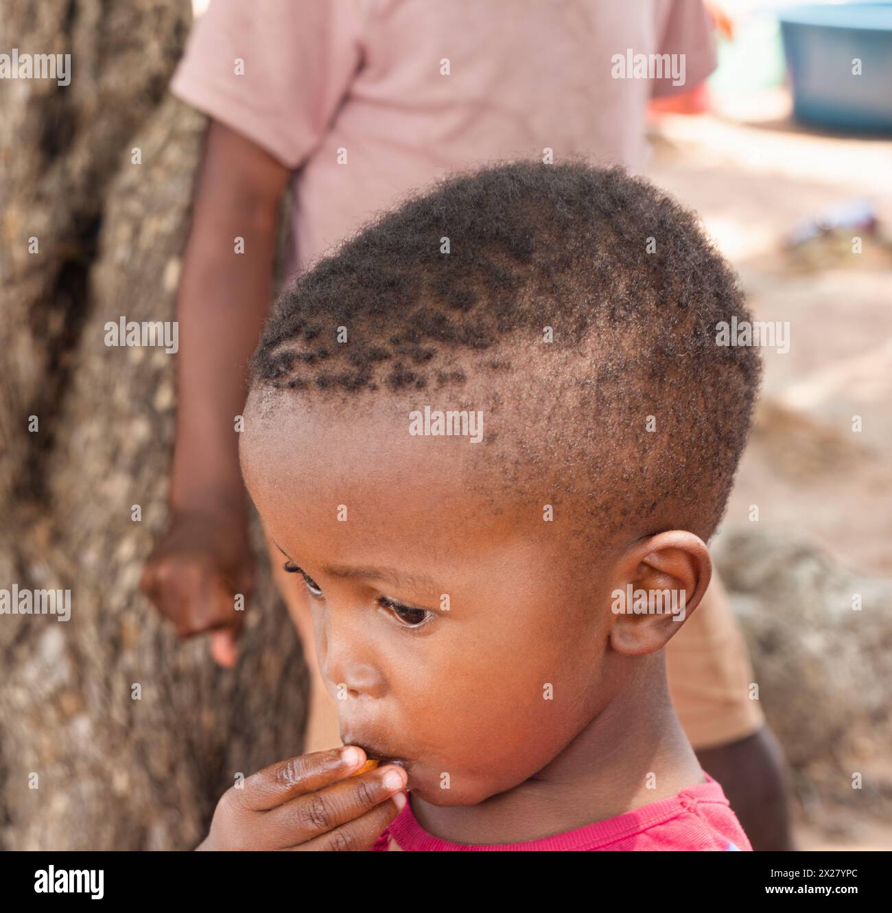 Hungry African Kid Eating Village In Africa Botswana Stock Photo Alamy