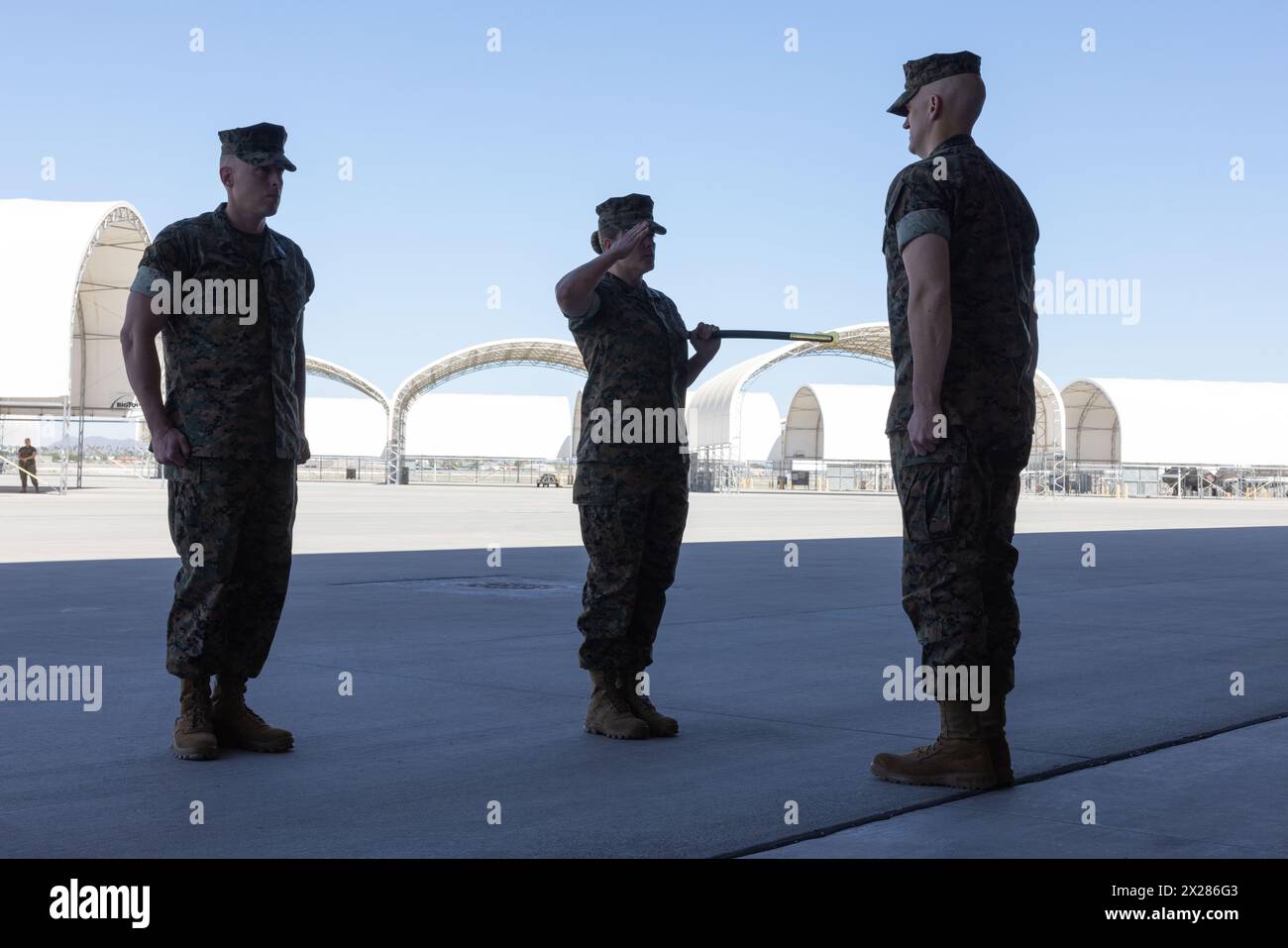 U.S. Marine Corps Sgt. Maj. Nicole L. Brooks, center, old sergeant major surrenders the sword of office to Lt. Col. Robert F. Guyette, right, commanding officer, both with Marine Fighter Attack Squadron (VMFA) 214, 3rd Marine Aircraft Wing, during VMFA-214’s Relief and Appointment ceremony at Marine Corps Air Station Yuma, Arizona, April 19, 2024. Brooks's personal awards include the Defense Meritorious Service Medal, Meritorious Service Medal, Navy and Marine Corps Commendation Medal (3 gold stars in lieu of 4th award), and Navy and Marine Corps Achievement Medal. (U.S. Marine Corps photo by Stock Photo