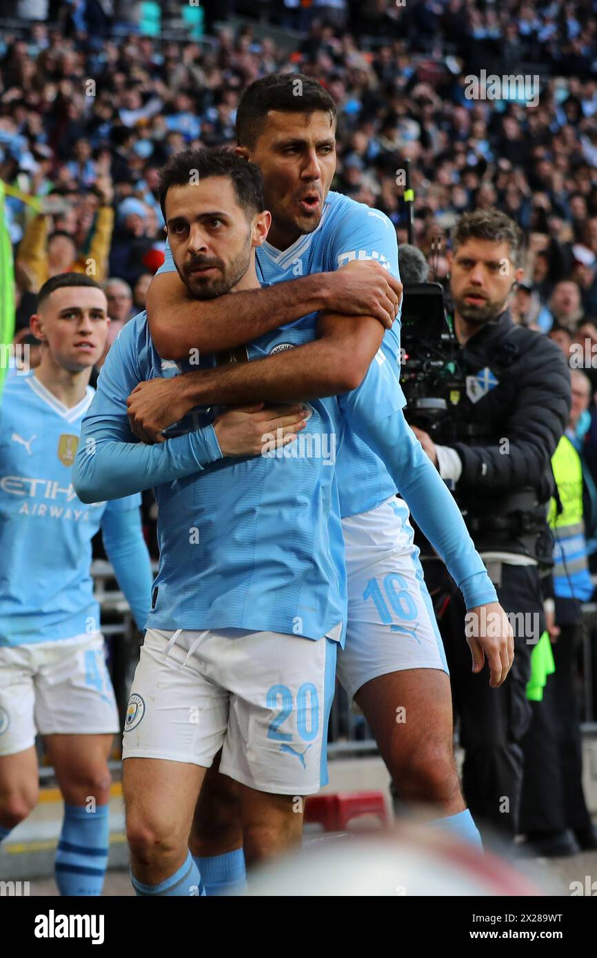 London, UK. 20th Apr, 2024. Bernardo Silva of Manchester City celebrates with Rodri of Manchester City (r) after he scores his teams 1st goal. The Emirates FA Cup, semi final, Manchester City v Chelsea at Wembley Stadium in London on Saturday 20th April 2024. Editorial use only. pic by Andrew Orchard/Andrew Orchard sports photography/Alamy Live News Credit: Andrew Orchard sports photography/Alamy Live News Stock Photo