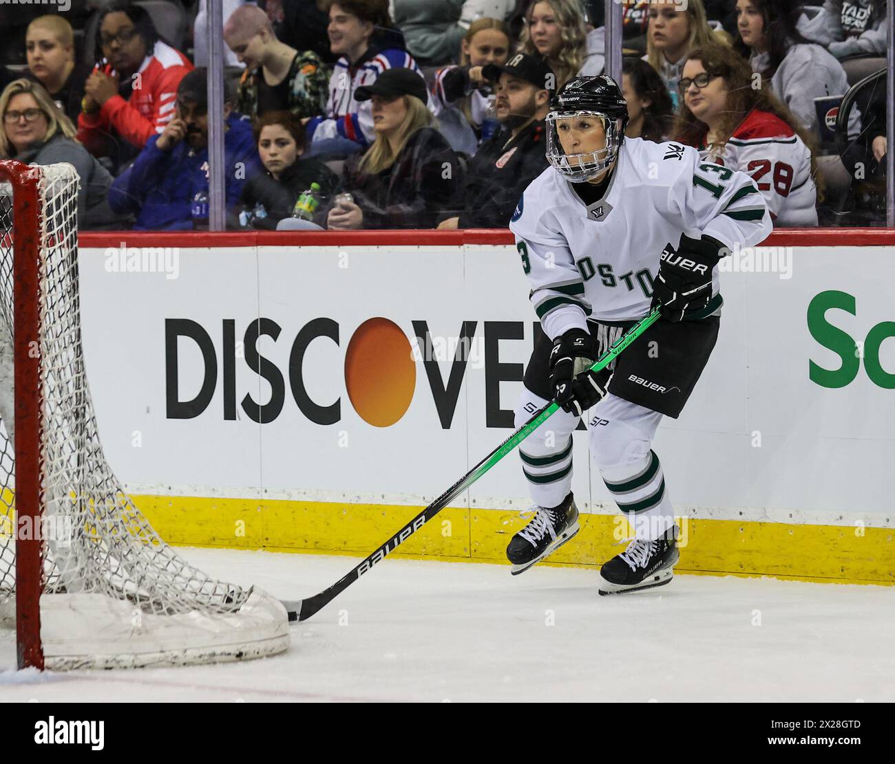 Newark, NJ, USA. 20th Apr, 2024. Boston defender Kaleigh Fratkin (13) skates with the puck behind the net during the PWHL game between Boston and New York at the Prudential Center in Newark, NJ. Mike Langish/CSM (Credit Image: © Mike Langish/Cal Sport Media) (Credit Image: © Mike Langish/Cal Sport Media). Credit: csm/Alamy Live News Stock Photo