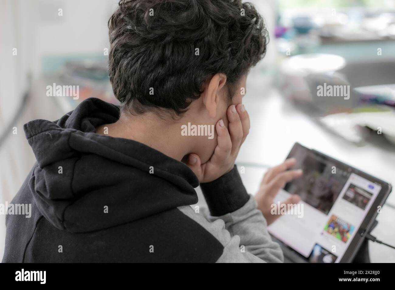 Young boy using digital tablet Stock Photo