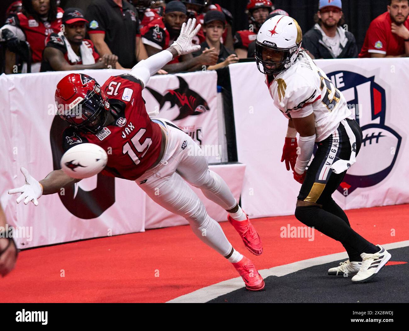 Jacksonville, Florida, USA. 20th Apr, 2024. Sharks WR Marquis McClain (#15) reaches for the ball but it's just beyond his reach while Knight Hawks DB Malik Hausman (#22) defends. Photo Credit: Tim Davis/Alamy Live News Stock Photo