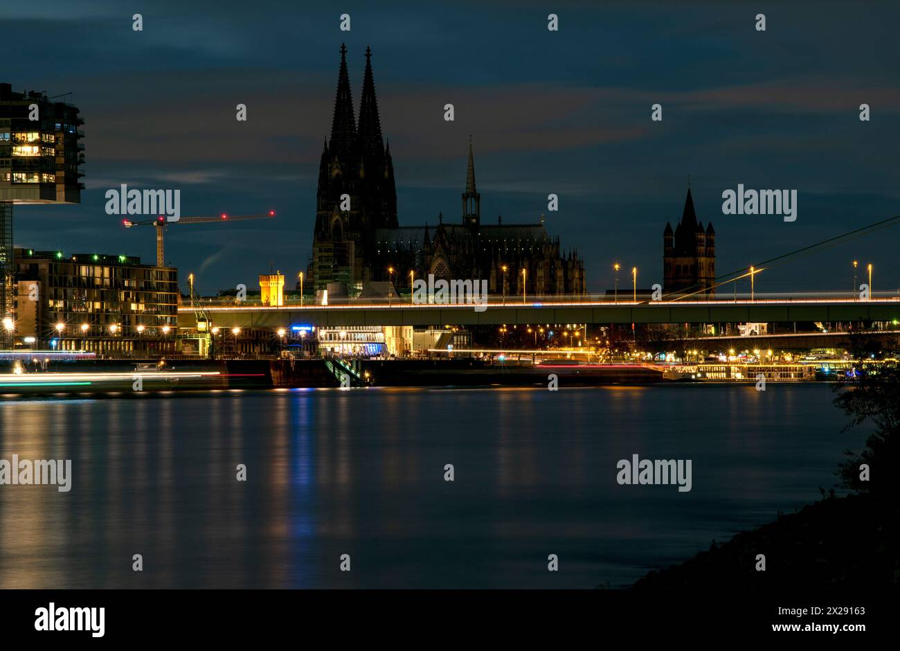 Night view on the City cathedral on the banks of the Rhine river. Cologne, Germany Stock Photo
