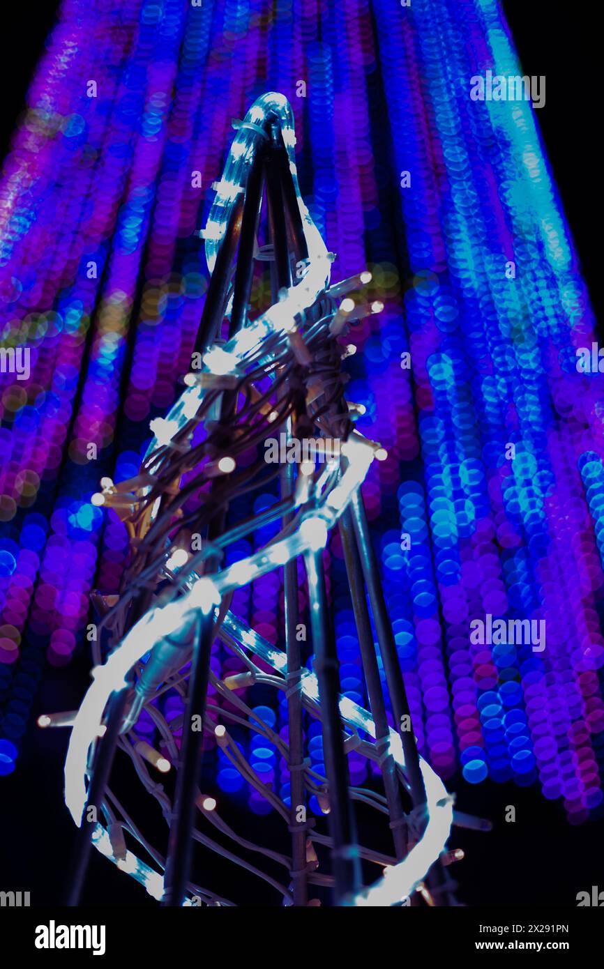 illuminated Christmastrees. artificial yellow and blue light with