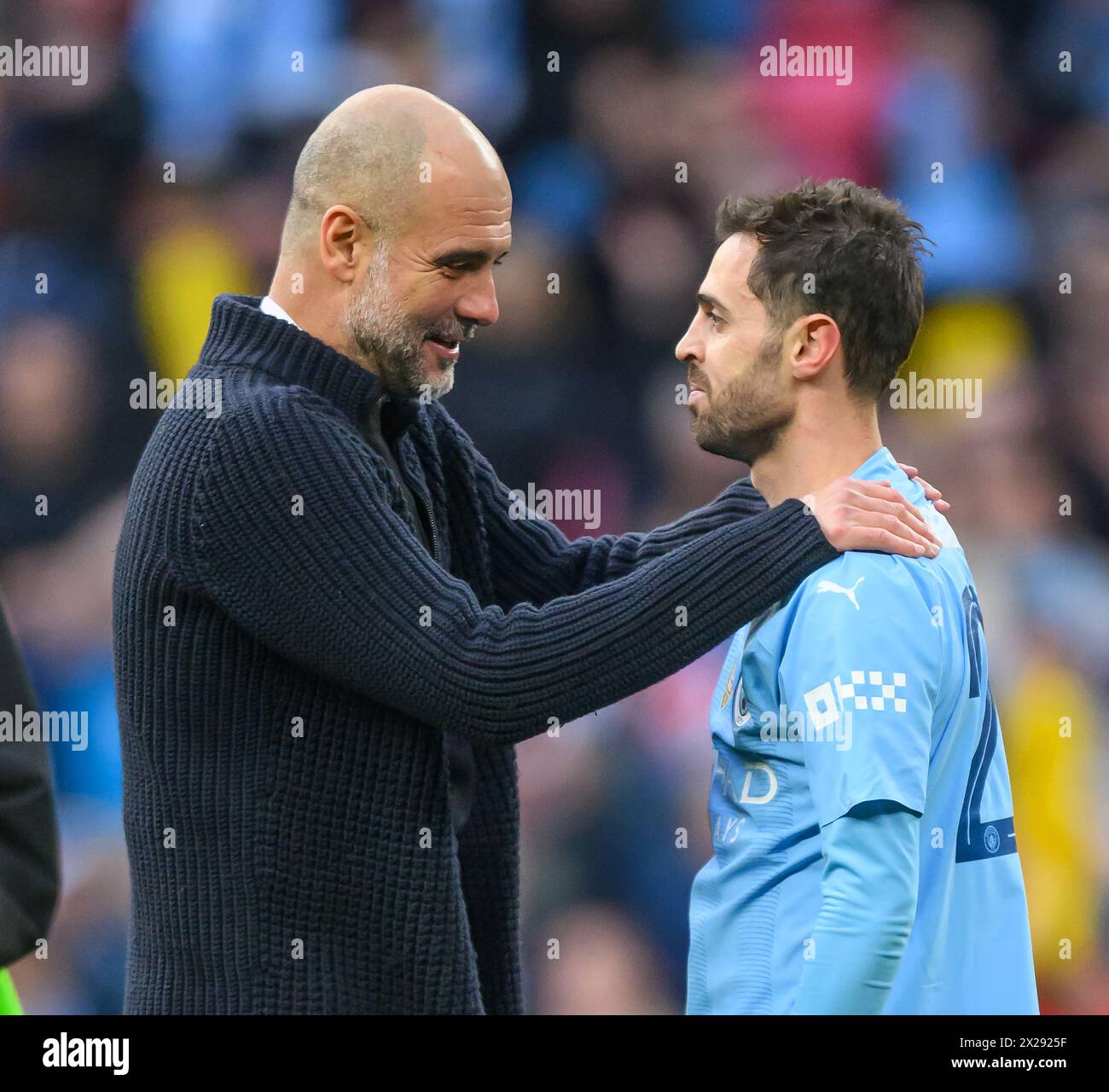 London, UK. 20th Apr, 2024. 20 Apr 2024 - Manchester City v Chelsea - FA Cup Semi-Final - Wembley. Pep Guardiola with goalscorer and match winner Bernardo Silva at the final whistle. Picture Credit: Mark Pain/Alamy Live News Stock Photo