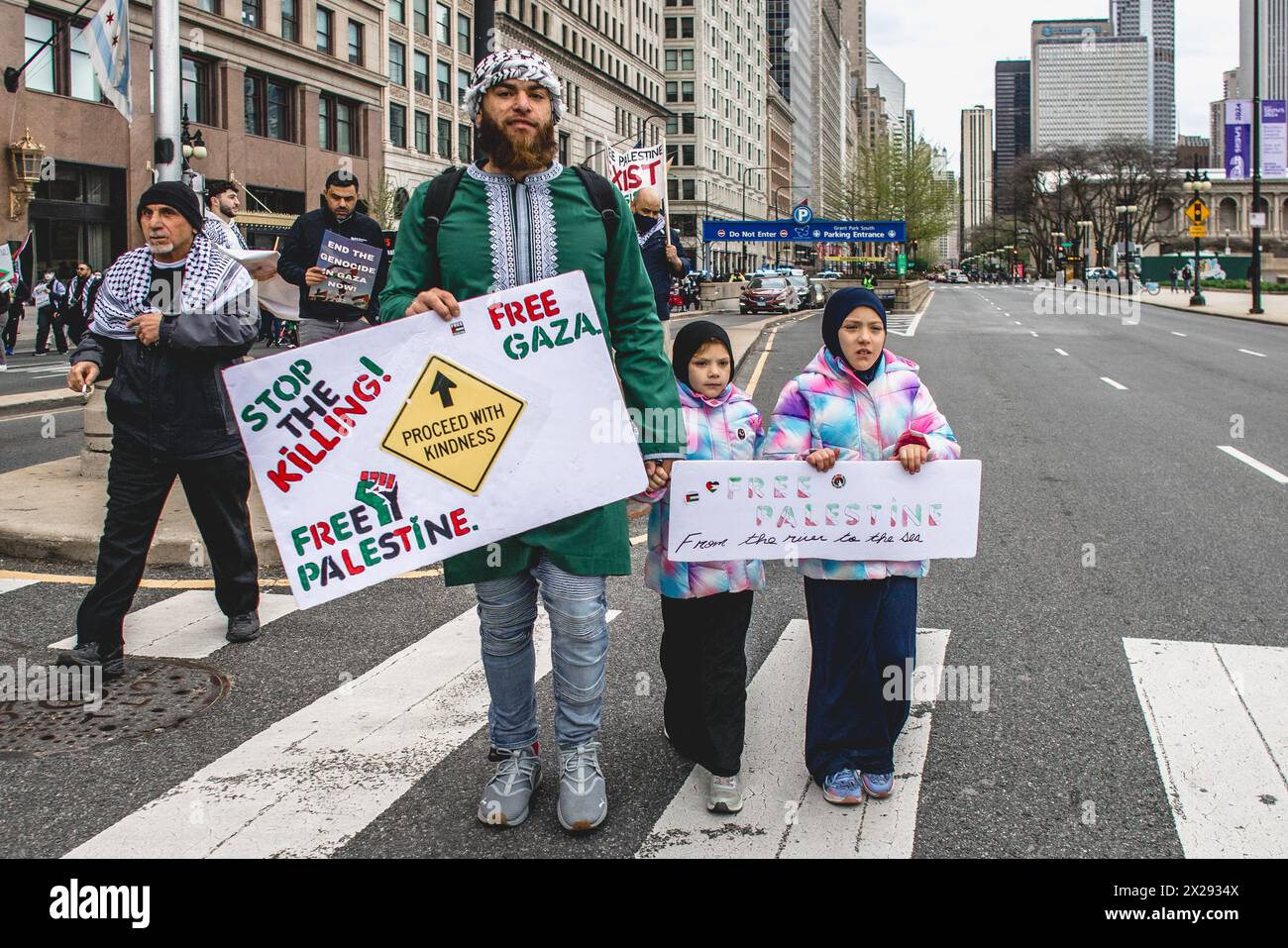 Chicago, US, 20th Apr 2024, A father and his children march through the streets of downtown Chicago to protest Israel occupation of Gaza, for Joe Biden to end US funding of Israel, and call for a ceasefire, Credit: David Jank/Alamy Live News Stock Photo