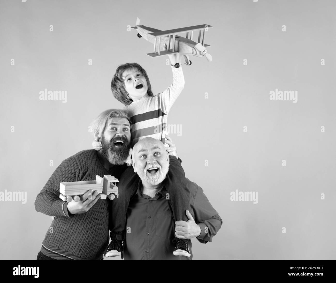 Three different generations ages grandfather father and child son