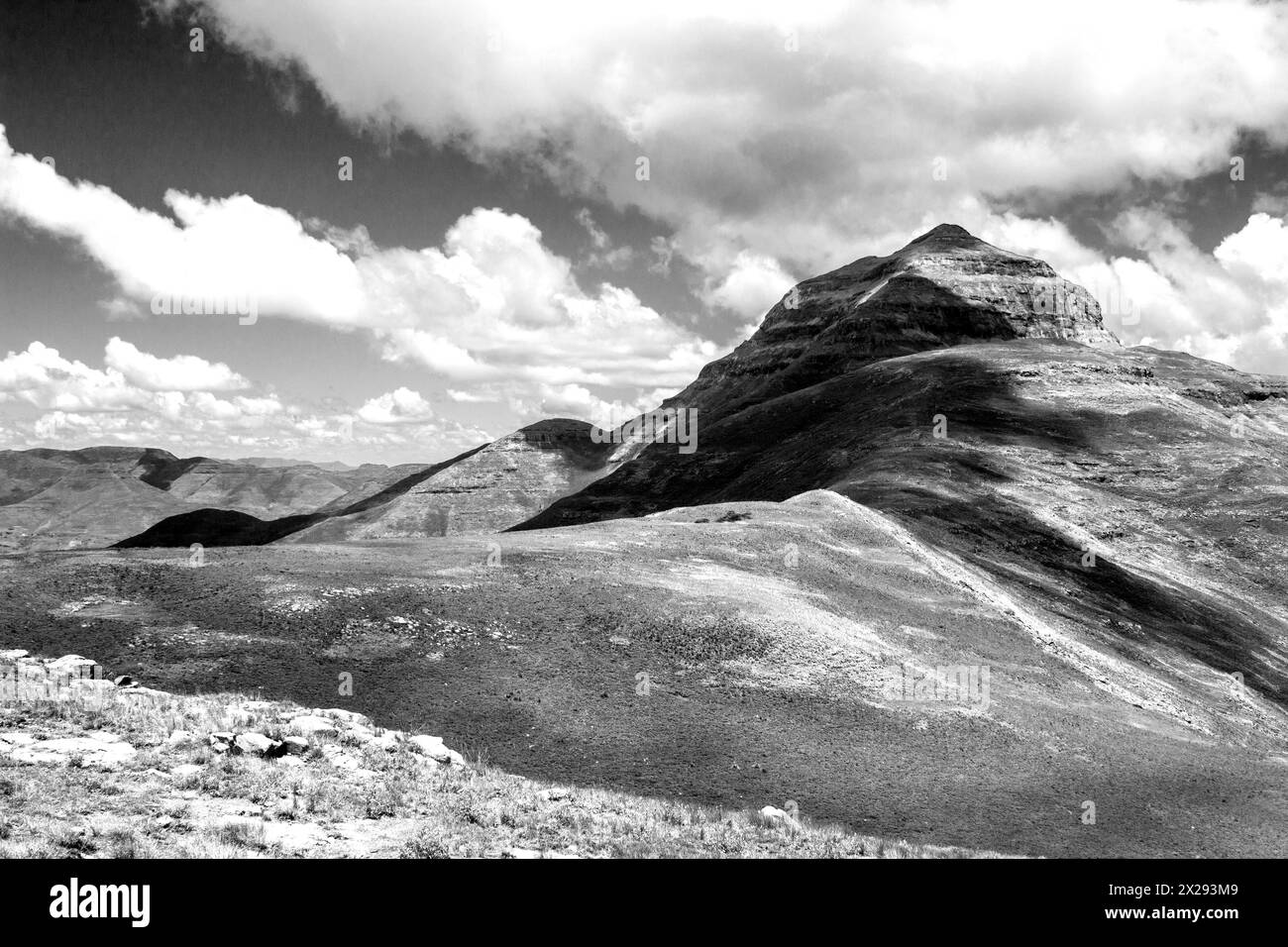 Dramatic Black and White view of Ribbok kop, one of the high peaks of the Drakensberg Mountains in South Africa, Stock Photo