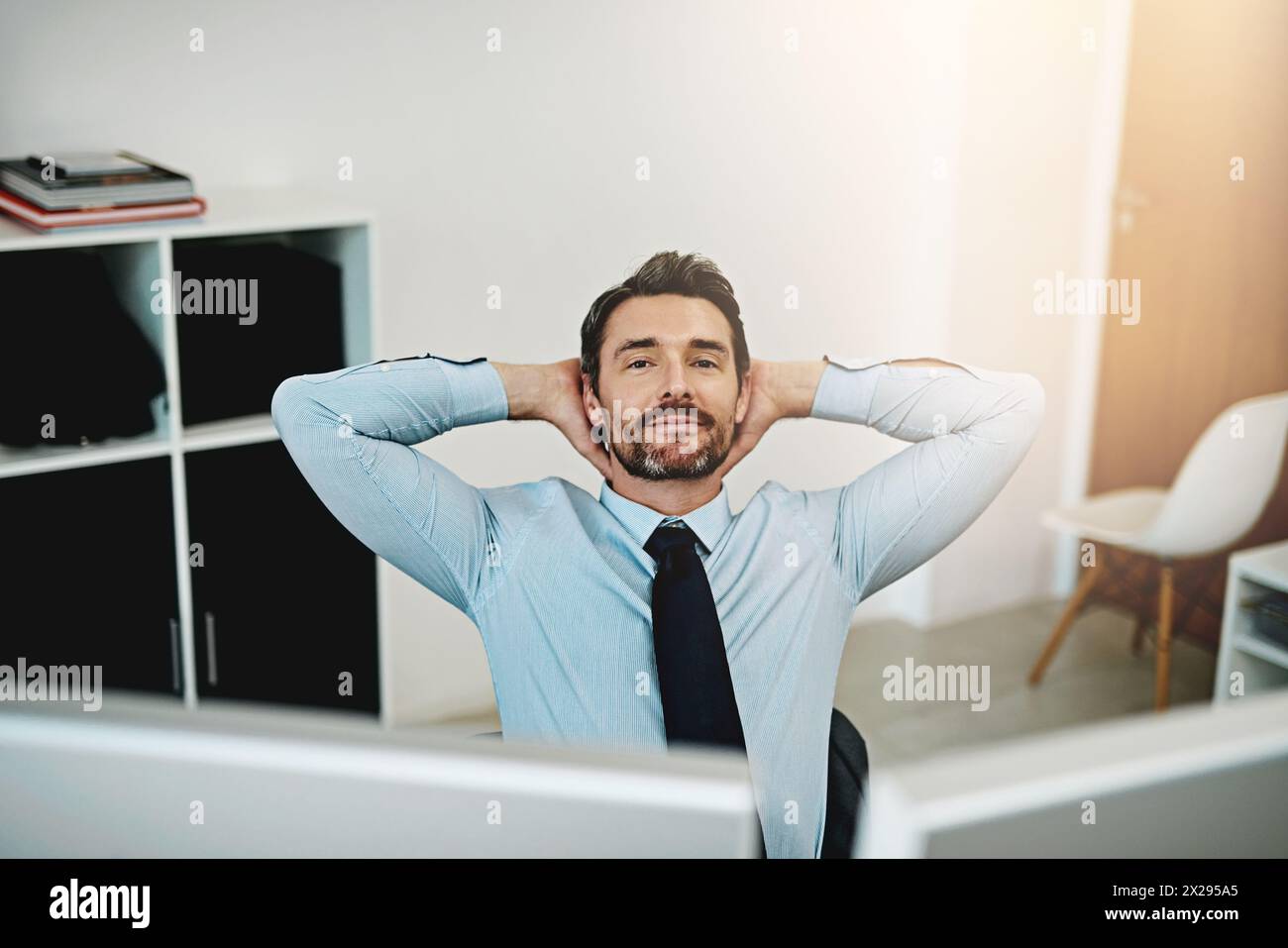 Business man, portrait and stretching at office desk for accounting, finance and startup or budget solution. Accountant, broker or worker on a break Stock Photo