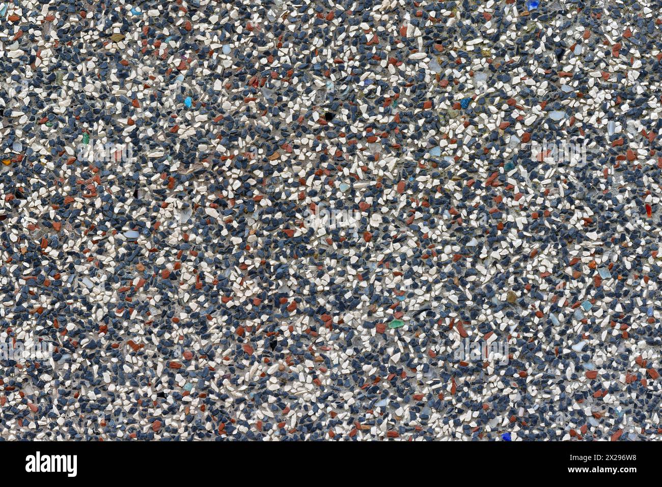 Colored Stone Plaster Texture: White-Blue-Red Variegated Stone Plaster Closeup Stock Photo