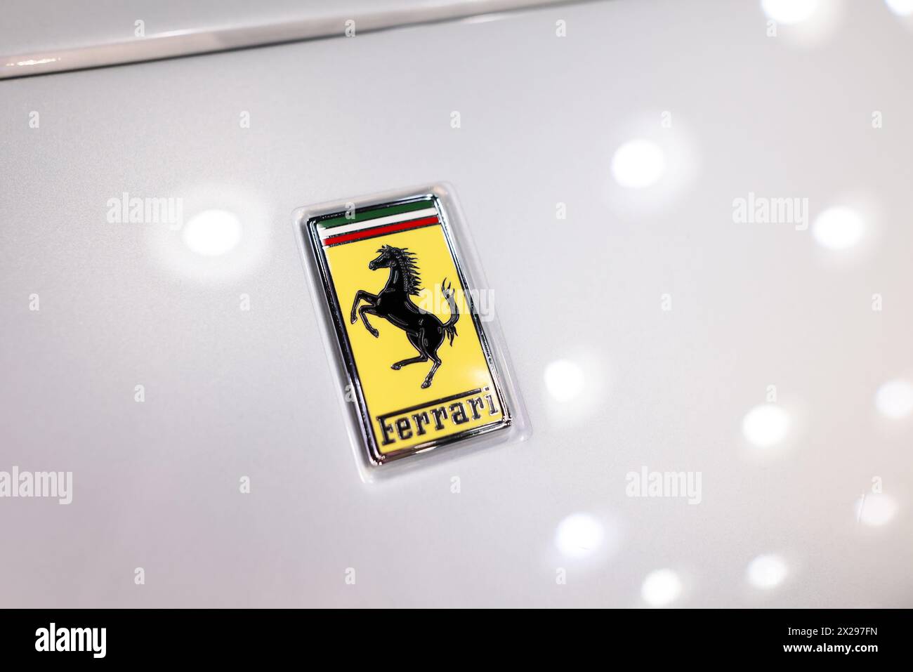 Bucharest, Romania - April 21, 2024: Details with the front part and emblem of a modern Ferrari sports car. Stock Photo