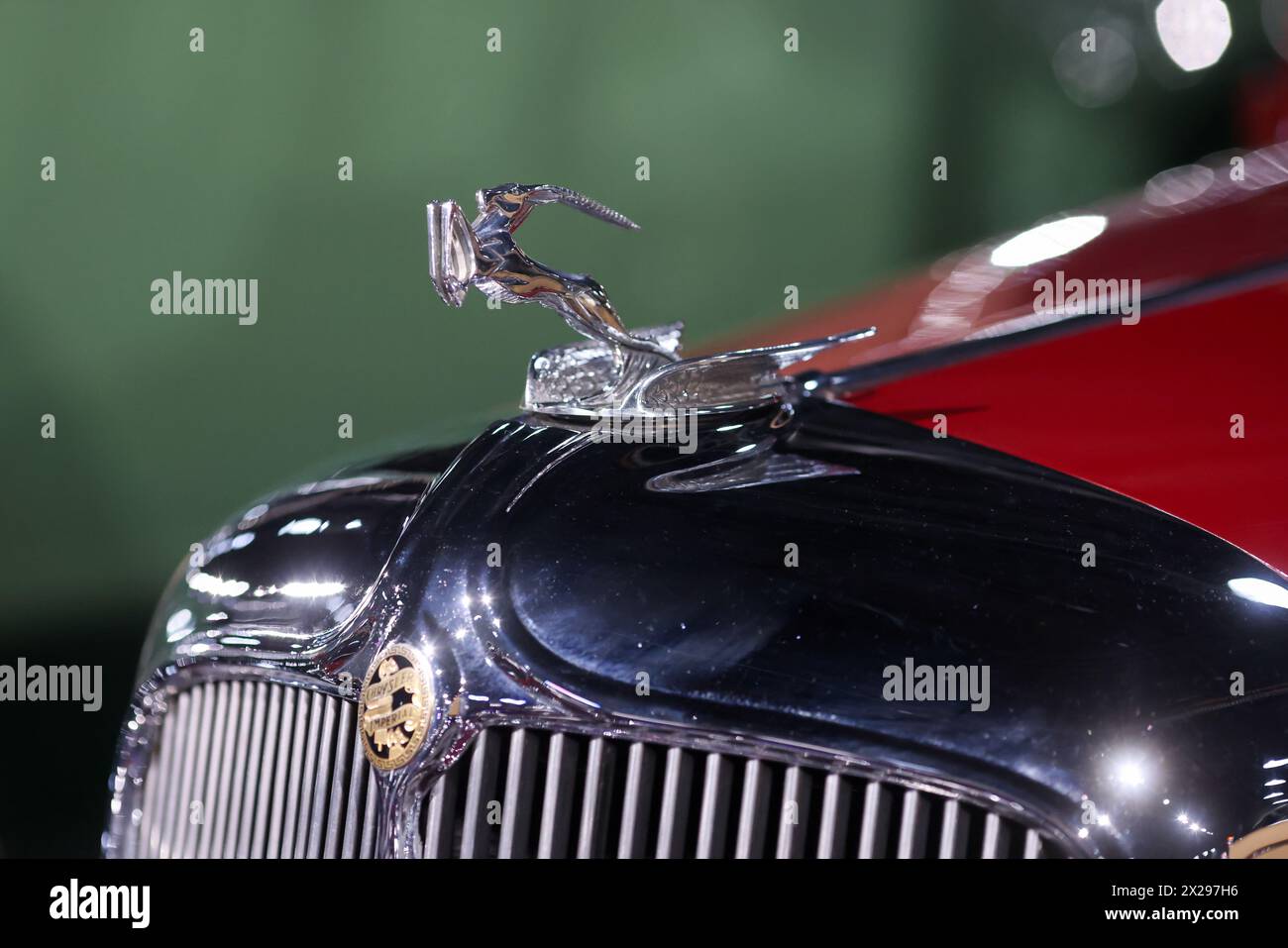 Bucharest, Romania - April 21, 2024: Details with the front part and emblem of a retro 1933 Chrysler Imperial convertible retro car. Stock Photo