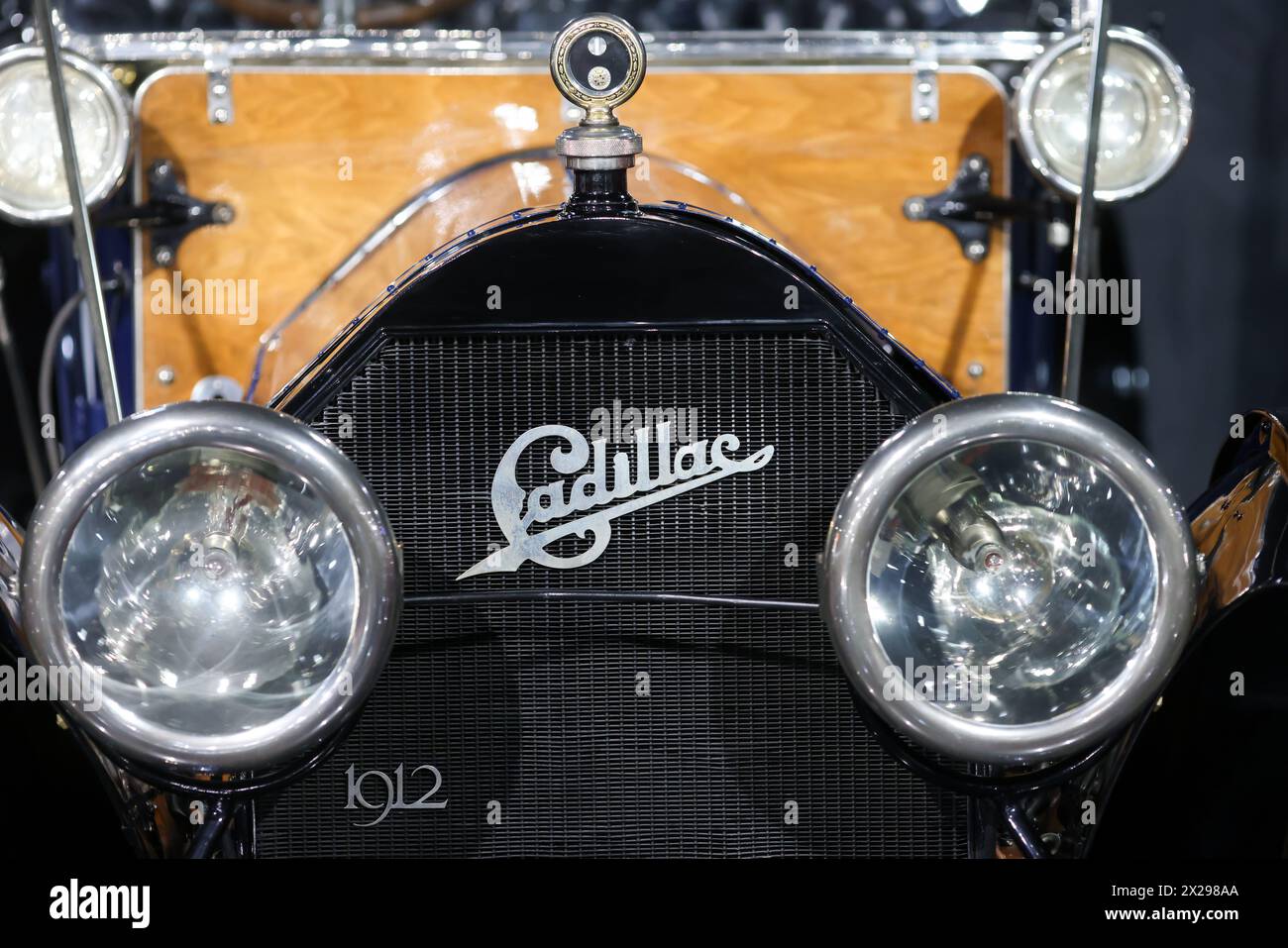 Bucharest, Romania - April 21, 2024: Details with the front part and emblem of a retro 1912 Cadillac Model 30 Torpedo Touring car. Stock Photo