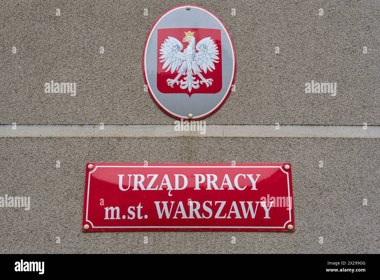 Metal plaque with the inscription Employment Office of the Capital City of Warsaw Stock Photo