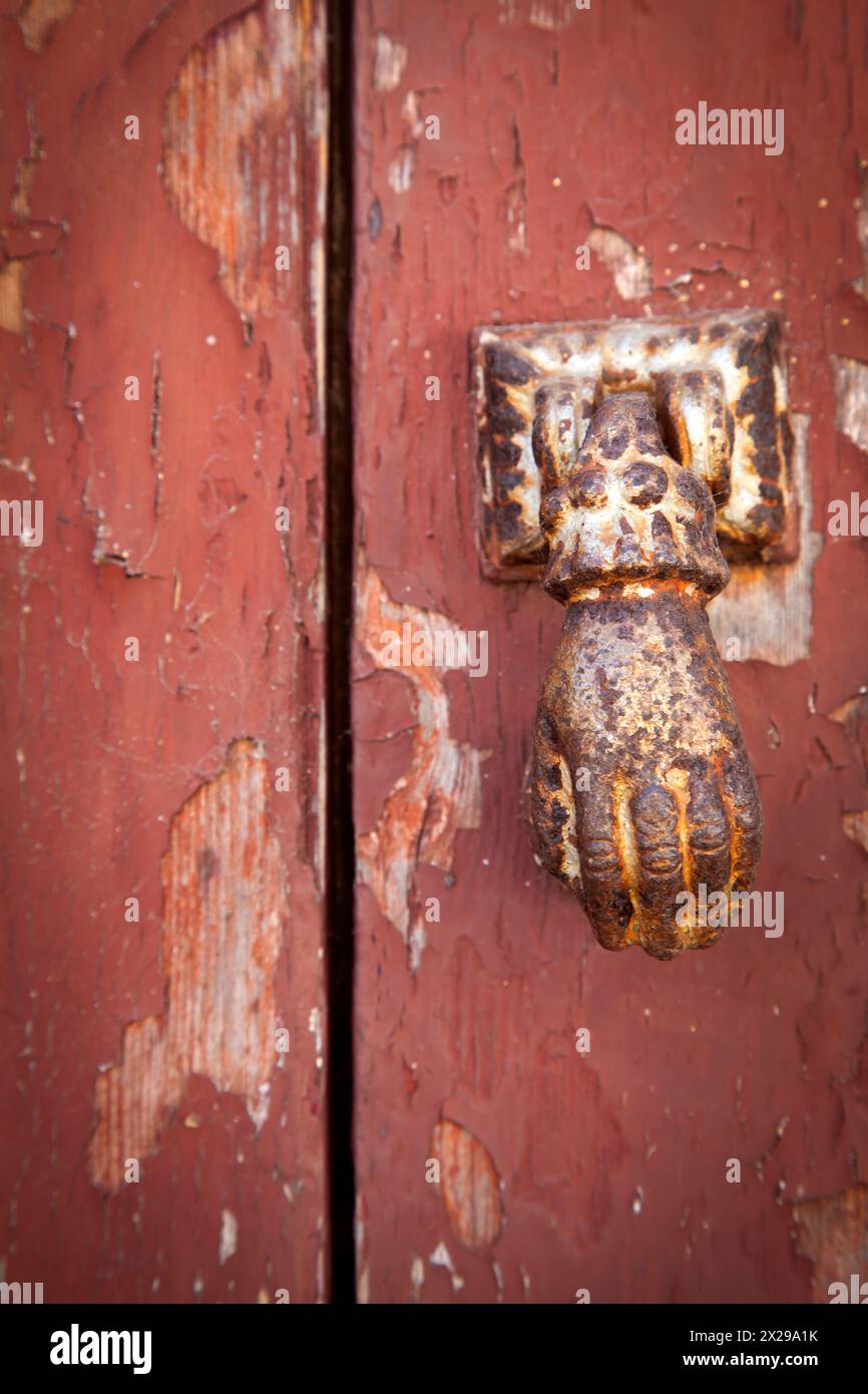 Rusted Hand Door Knocker Stock Photo