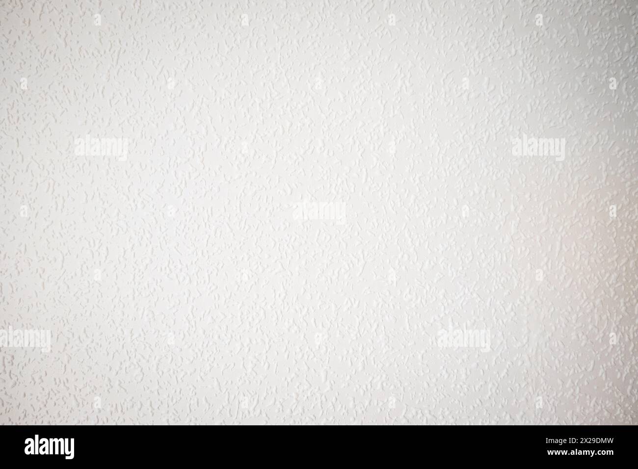 white painted woodchip wallpaper texture pattern backgroung. Stock Photo