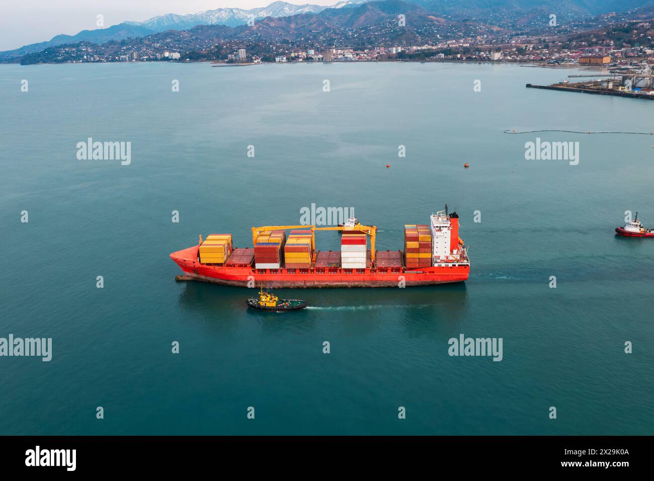 Aerial view of cargo ship loaded with containers for import and export ...