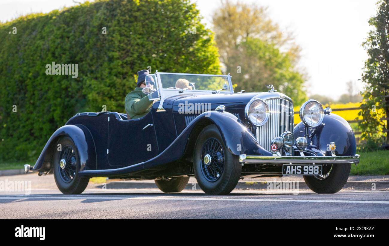 Bicester,UK,21st Apr 2024, Proud owners out with their 1938 Bentley car on the 2024 annual Drive It Day when enthusiasts use their classic and vintage cars to raise money for childrens charities. Stock Photo
