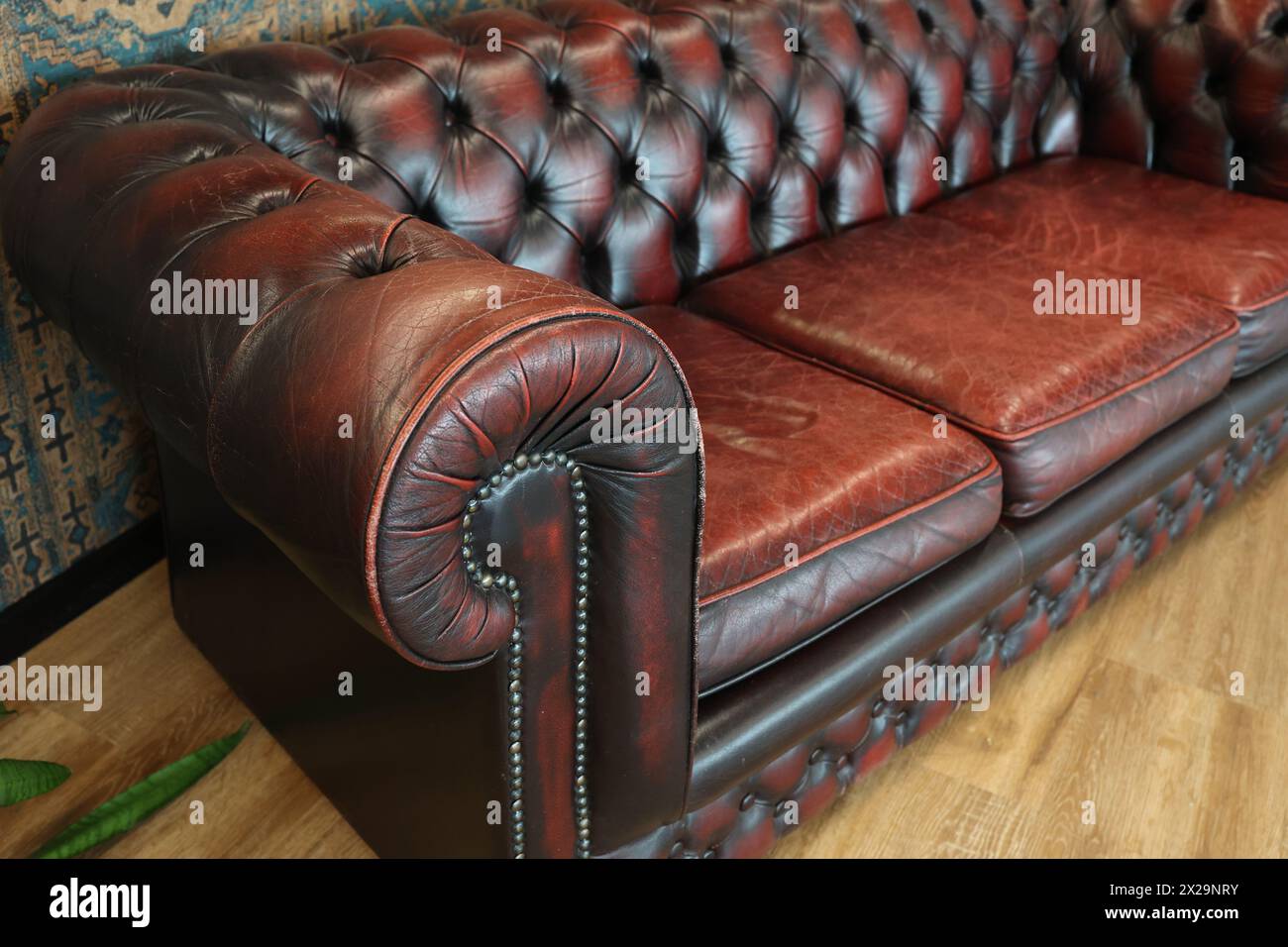 Fragment of an old leather sofa. Stock Photo